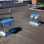 Évacuation sur toiture en asphalte